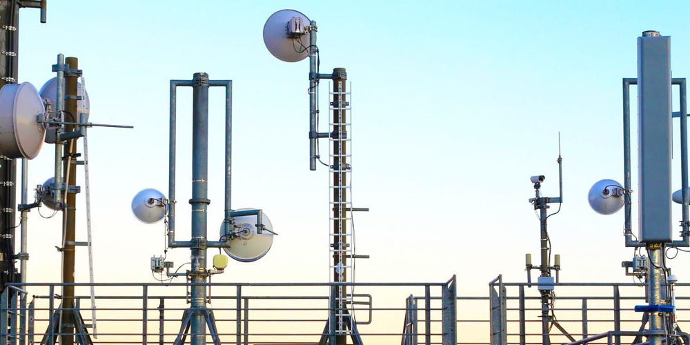 Satellite dishes and cameras on a rooftop