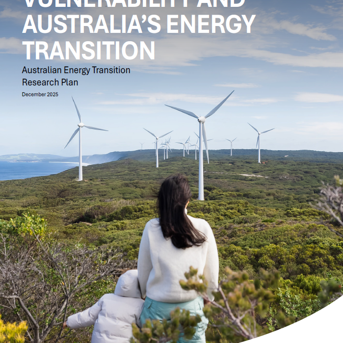 Vulnerability report cover Woman and child on a green mountain side with their backs turned to us, looking at a horizon with wind turbines.